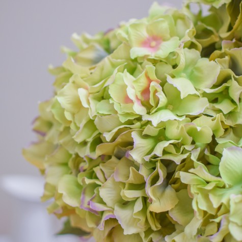 artificial hydrangea in metal pot