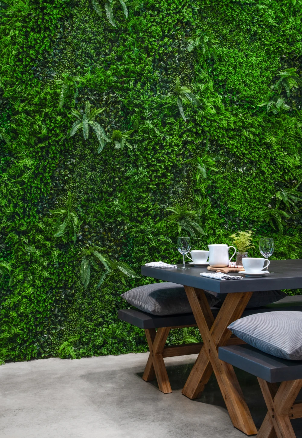 green wall with a table in front of it
