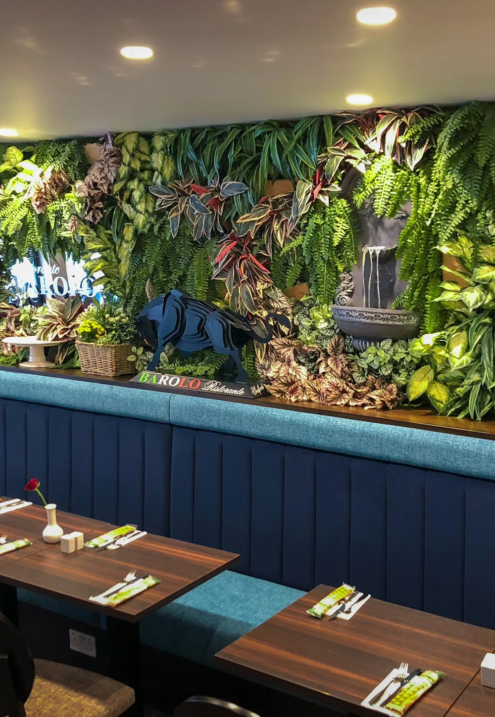a green wall installed in a restraunt