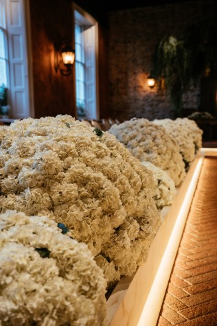Faux hydrangeas featured in the aisle walkway at the Croft Hotel